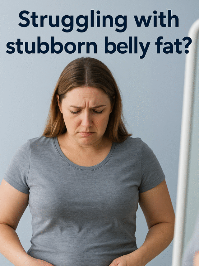 A woman looks at her stomach in the mirror with disappointment or feels uncomfortable adjusting her clothes.